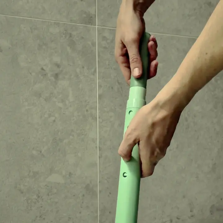 Oasis Shower Chair showing the height adjustable legs in motion